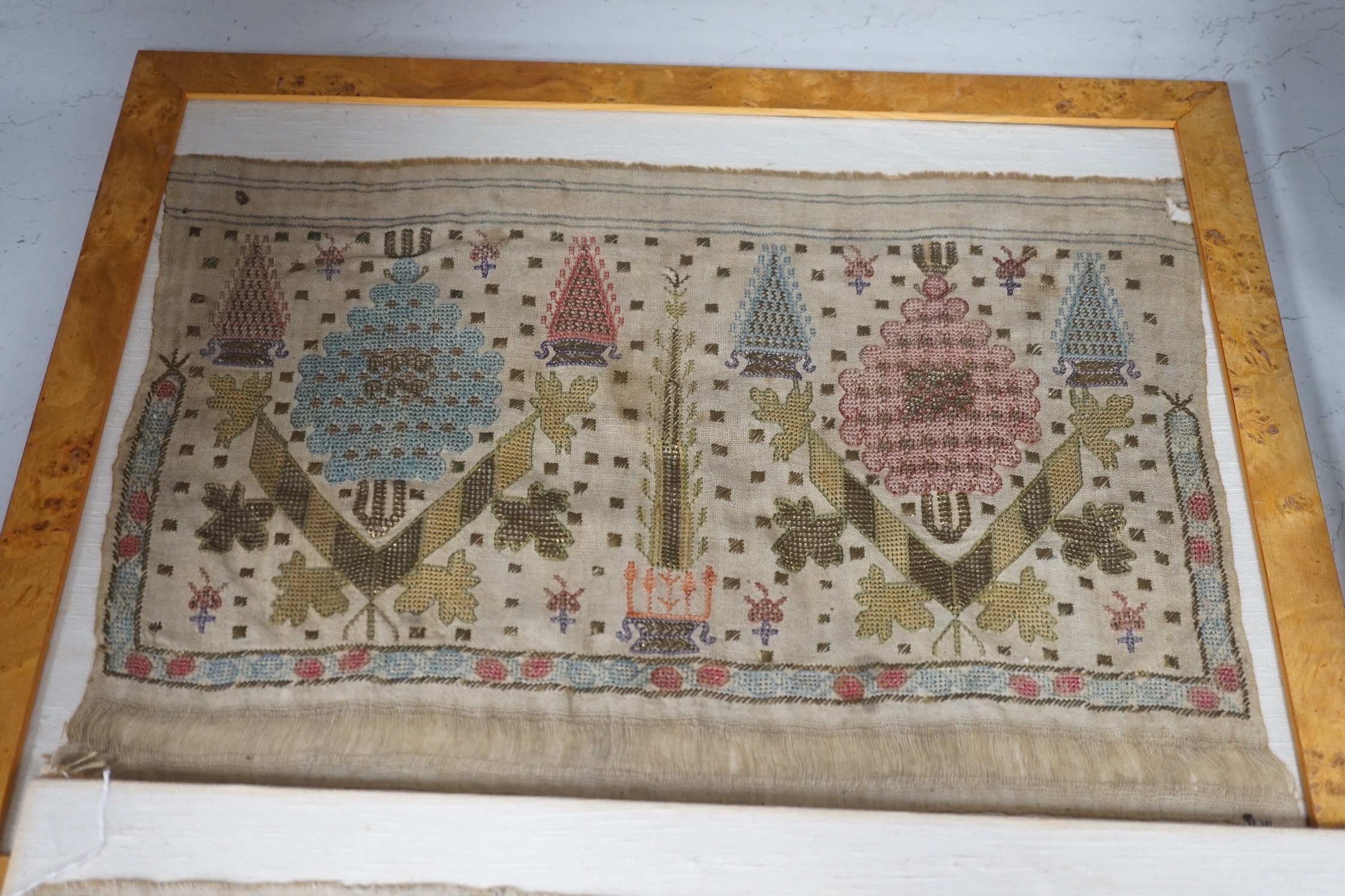 Two 19th century embroidered Turkish towel ends, one framed, 46cms wide x 30cms high